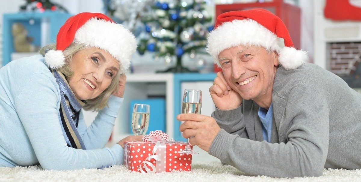 Senior couple celebrating holidays with champagne