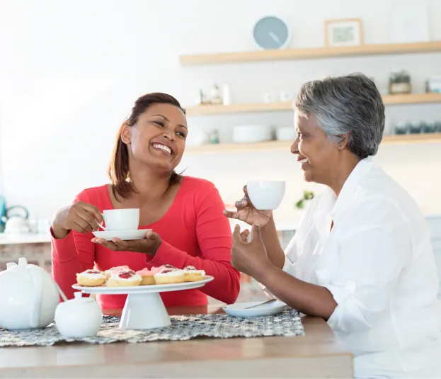 Two woman smile